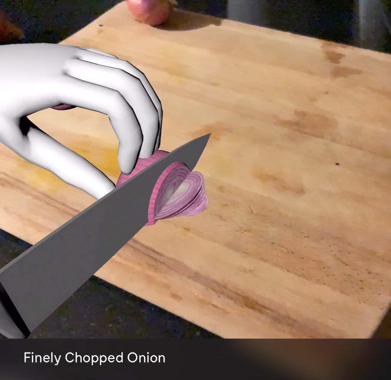 Disembodied hands demonstrating knife technique on finely chopped onion